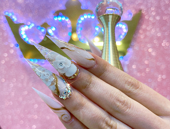 Stiletto nails with white floral design