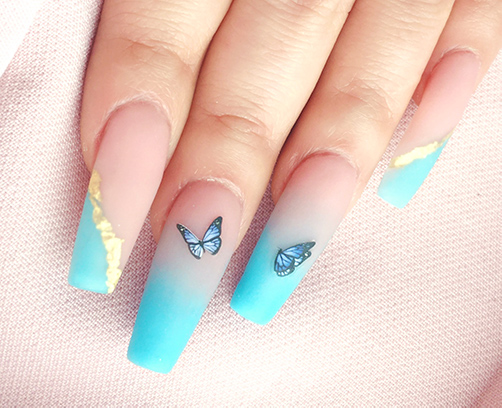 Blue Ombre nails with gold flakes and butterfly design