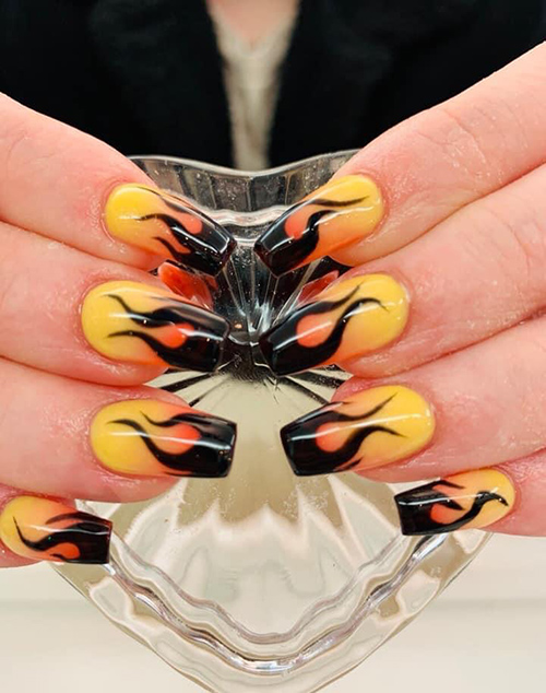 Coffin shaped nails with orange and black flames design